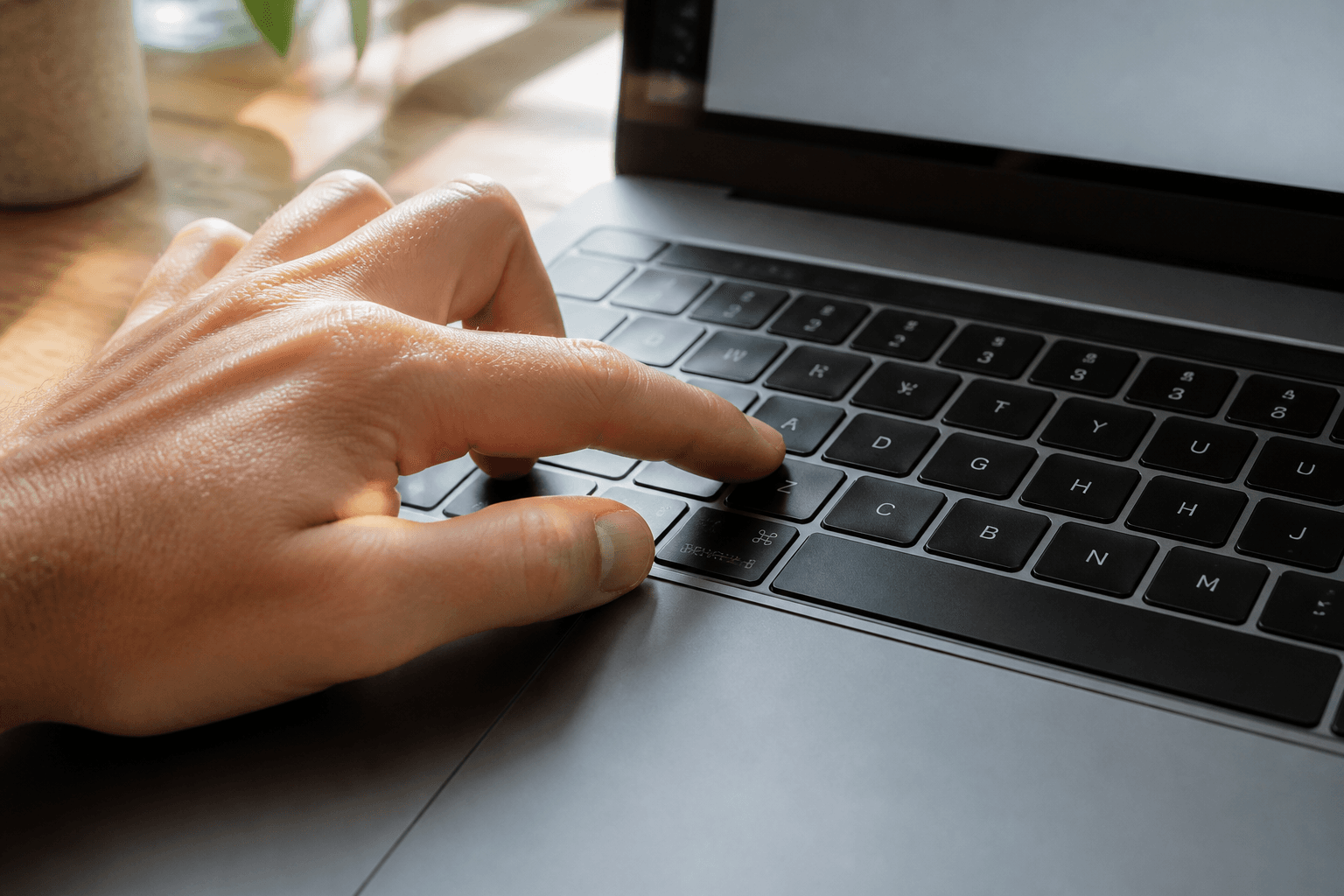 Hand using a keyboard shortcut to open a command palette